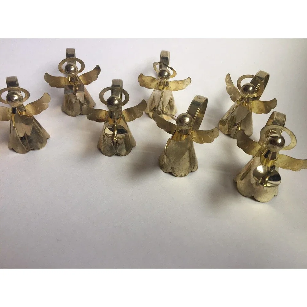 Set of 8 vintage napkin rings trumpet singing drums and candle